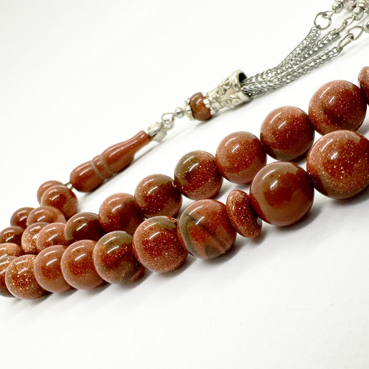 حجر نجومي بني 10 ملي 33 حبايه