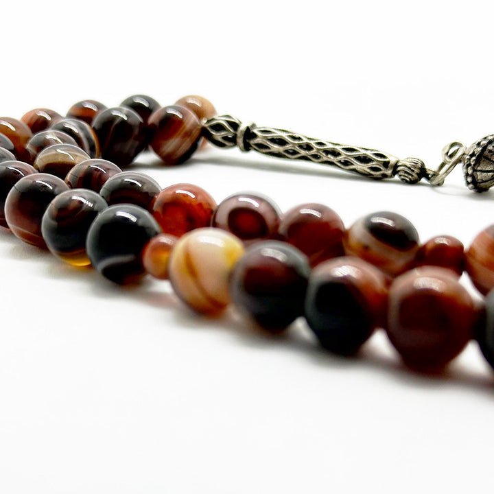 999 حجر عقيق سليماني عيون احمر 10 ملي 33 حبايه دلايه فضه