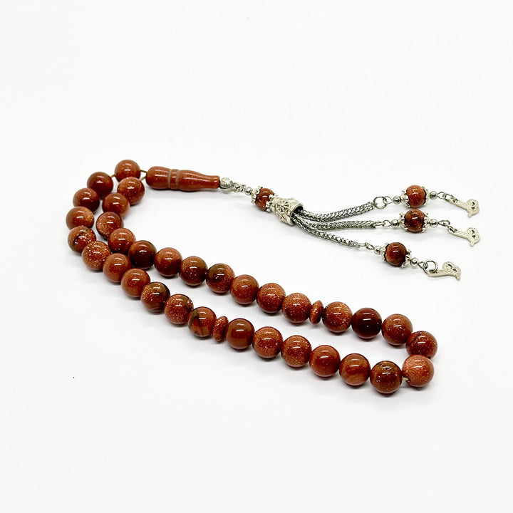 حجر نجومي بني 10 ملي 33 حبايه