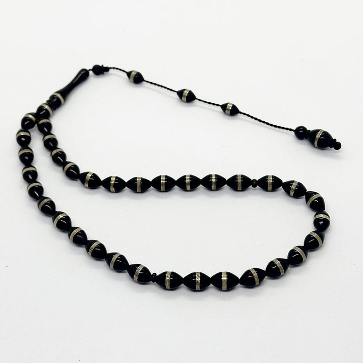 كوك اسود زيتونه بالمعدن 8 ملي 33 حبايه